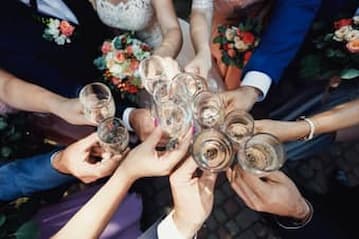 wedding guests toasting champagne flutes